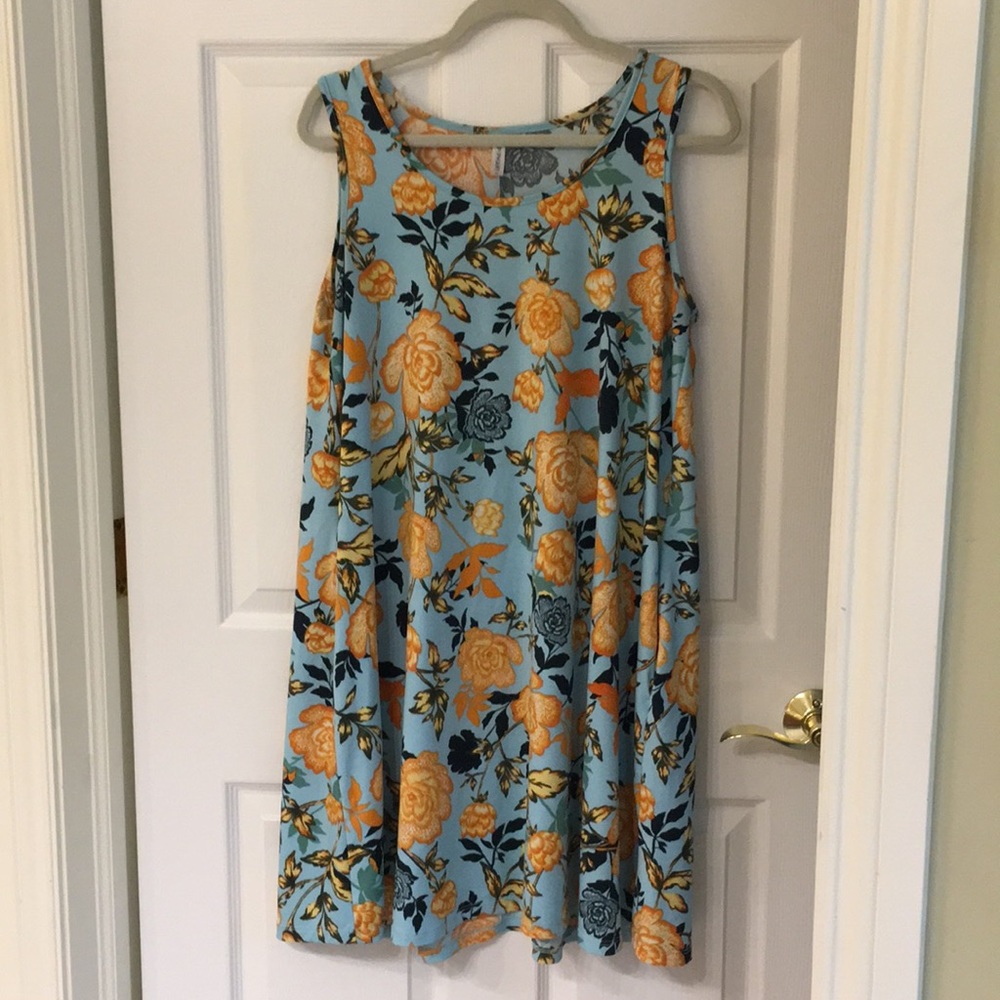 Sleeveless floral swing dress.